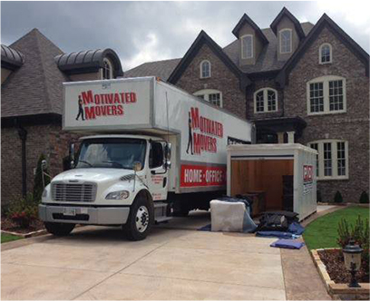 A Motivated Movers Nashville truck is parked in front of a large house, ready to serve.
